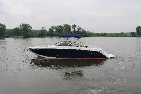 Cobalt R30 2020 Cobalt R30 boat on a calm lake with trees in the background.