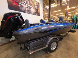 Ranger 1880MS 2025 Ranger 1880MS boat in showroom, blue and black design, on trailer.