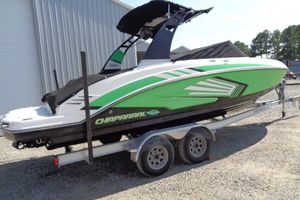 Chaparral Vortex 243 VRX 2018 Chaparral Vortex 243 VRX boat with green and white design on a trailer.