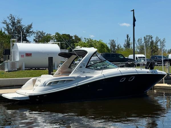 Sea Ray 330 Sundancer 2008 Sea Ray 330 Sundancer yacht docked at marina under clear blue sky.