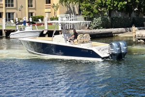 Jupiter 29 FS CC 2012 Jupiter 29 FS CC boat cruising on a sunny waterfront.