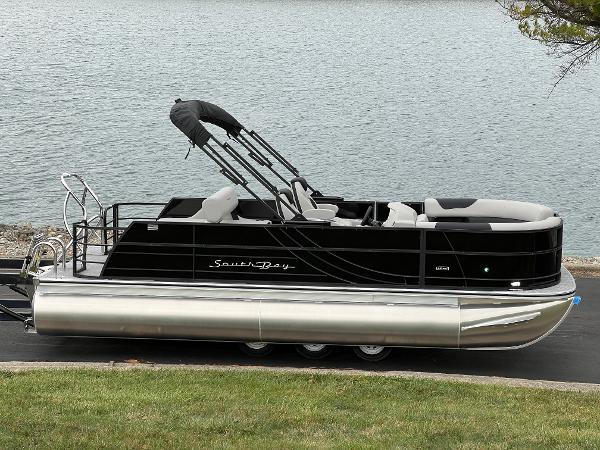 South Bay LE 222 UL 2025 South Bay LE 222 UL pontoon boat by the water.
