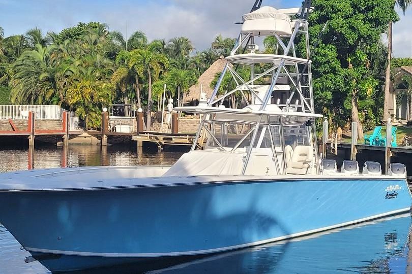 SeaHunter 45 Tournament 2014 SeaHunter 45 Tournament boat docked, featuring a blue hull and tower, surrounded by tropical scenery.