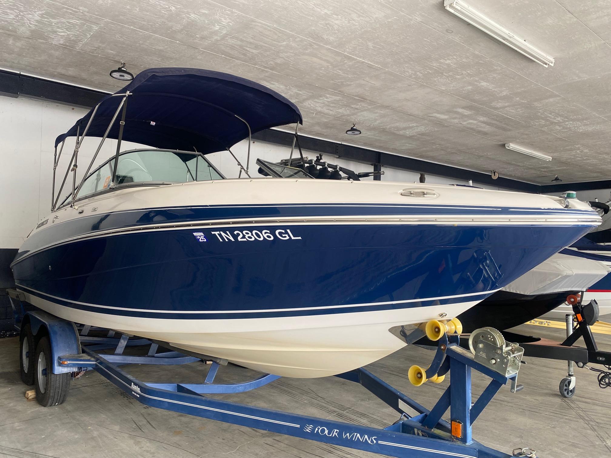 Four Winns H260 2008 Four Winns H260 boat on trailer in indoor storage.