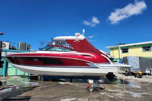 Formula 350 Crossover Bowrider 2015 Formula 350 Crossover Bowrider boat on dry dock under clear blue sky.