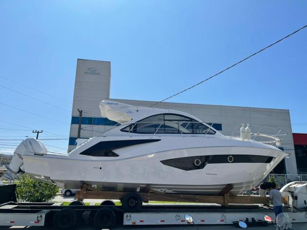 Evolve 400HT Evolve 400HT 2021 yacht on trailer, displayed outdoors under clear blue sky.