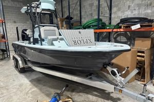 Xplor 24 Andros 2021 Xplor 24 an boat on trailer in warehouse setting.