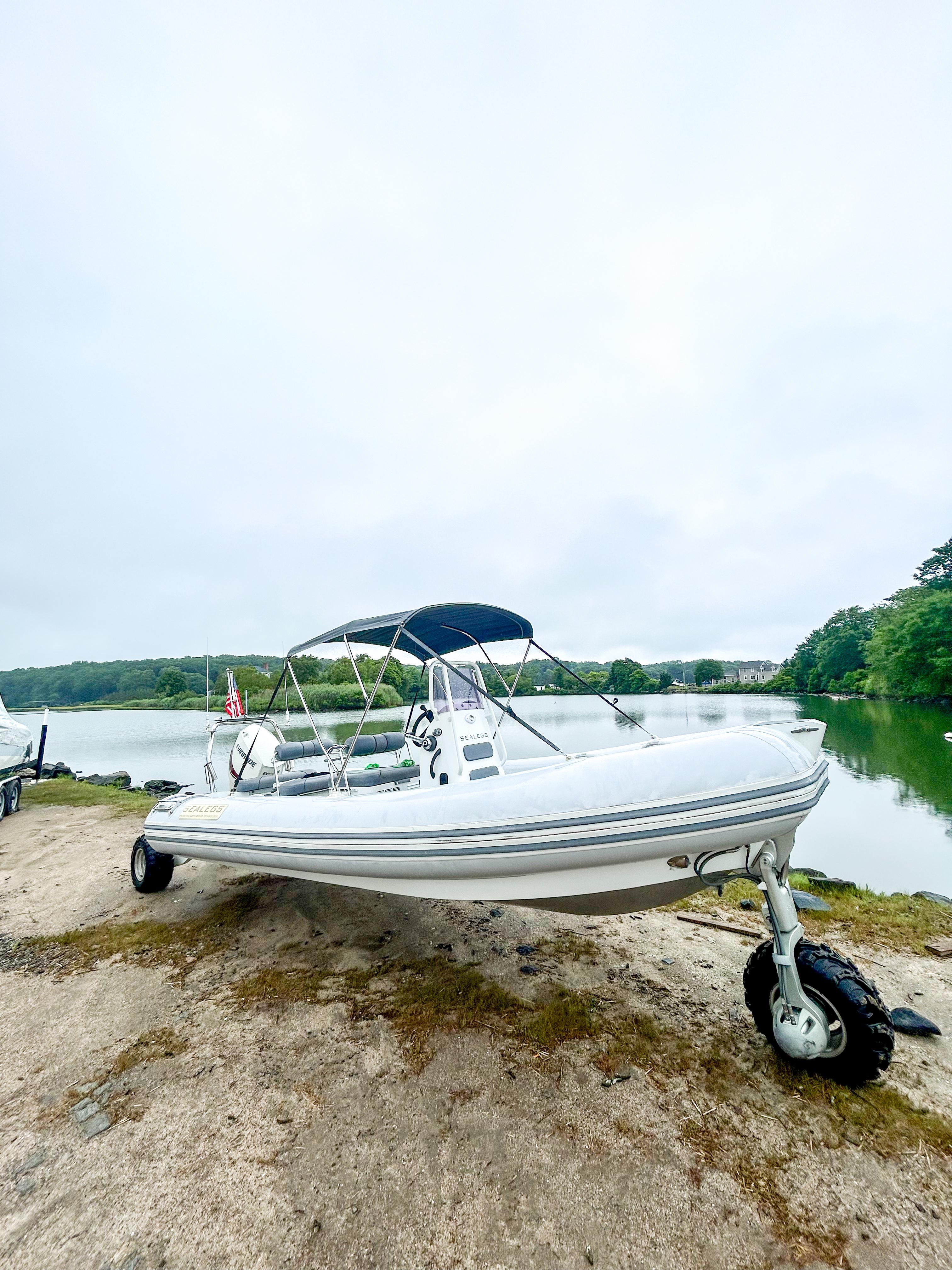 Sealegs 7.1m RIB 2014 Sealegs 7.1m RIB with wheels on a lakeside shore.