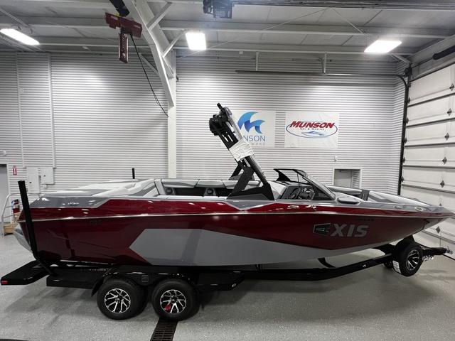 Axis A245 2024 Axis Wake Research A245 boat in showroom, featuring sleek design and modern detailing.