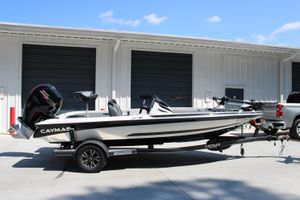Caymas CX 18 SS 2022 Caymas CX 18 SS boat on trailer, parked outside a garage.