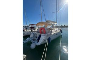 Beneteau Oceanis 40 2011 Beneteau Oceanis 40 sailboat docked in sunny marina.