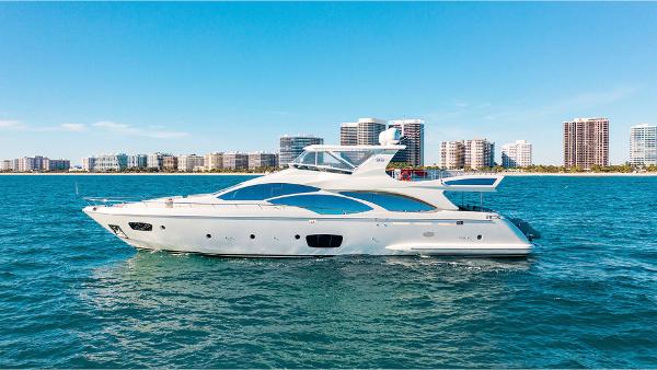Azimut Azimut 95 Azimut 95 yacht cruising on blue water with city skyline in the background, 2010 model.