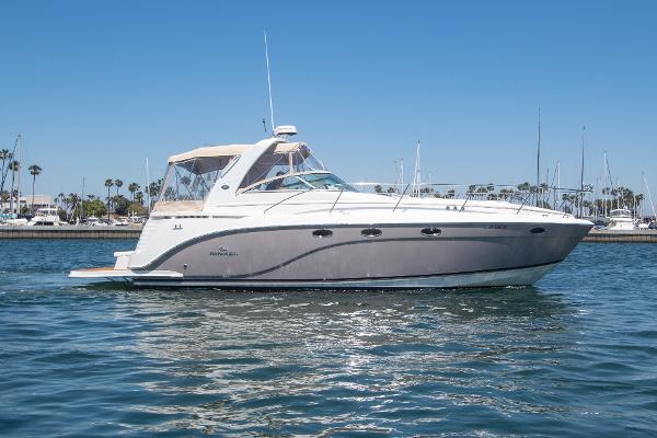 Rinker 400 Express Cruiser 2008 Rinker 400 Express Cruiser on calm water with marina background.