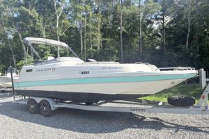 Splendor 239 Sunstar 2022 Splendor 239 Sunstar boat on trailer, parked outdoors with trees in background.