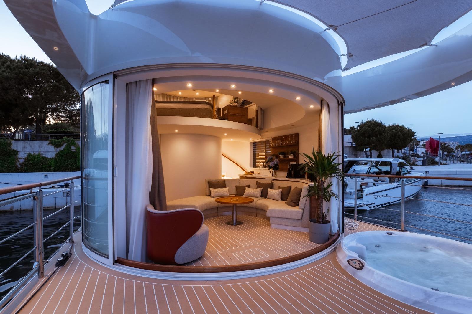 Oasis Meu Amor 39 Luxurious 2025 Oasis Meu Amor 39 yacht interior with modern design and outdoor jacuzzi.