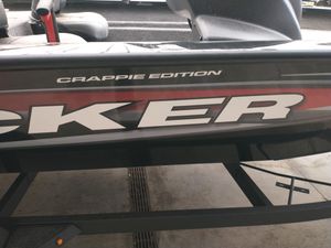 Tracker Pro Team 175 Crappie Edition 2025 Tracker Pro Team 175 Crappie Edition boat, partial side view in a garage.