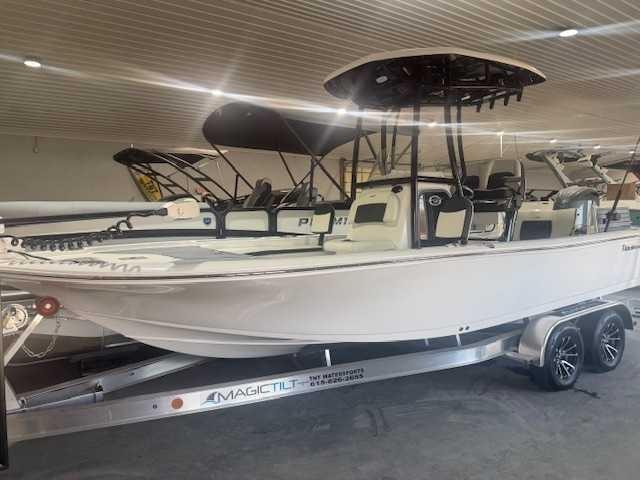 Tidewater 2210CB 2024 Tidewater 2210CB boat on Magic Tilt trailer in showroom.
