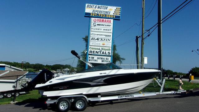 Monterey M-225 2023 Monterey M-225 boat on trailer at dealership with rental services sign.