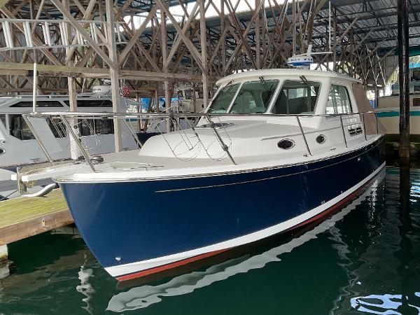 Back Cove 30 2016 Back Cove 30 boat docked in a marina, featuring a sleek blue hull.