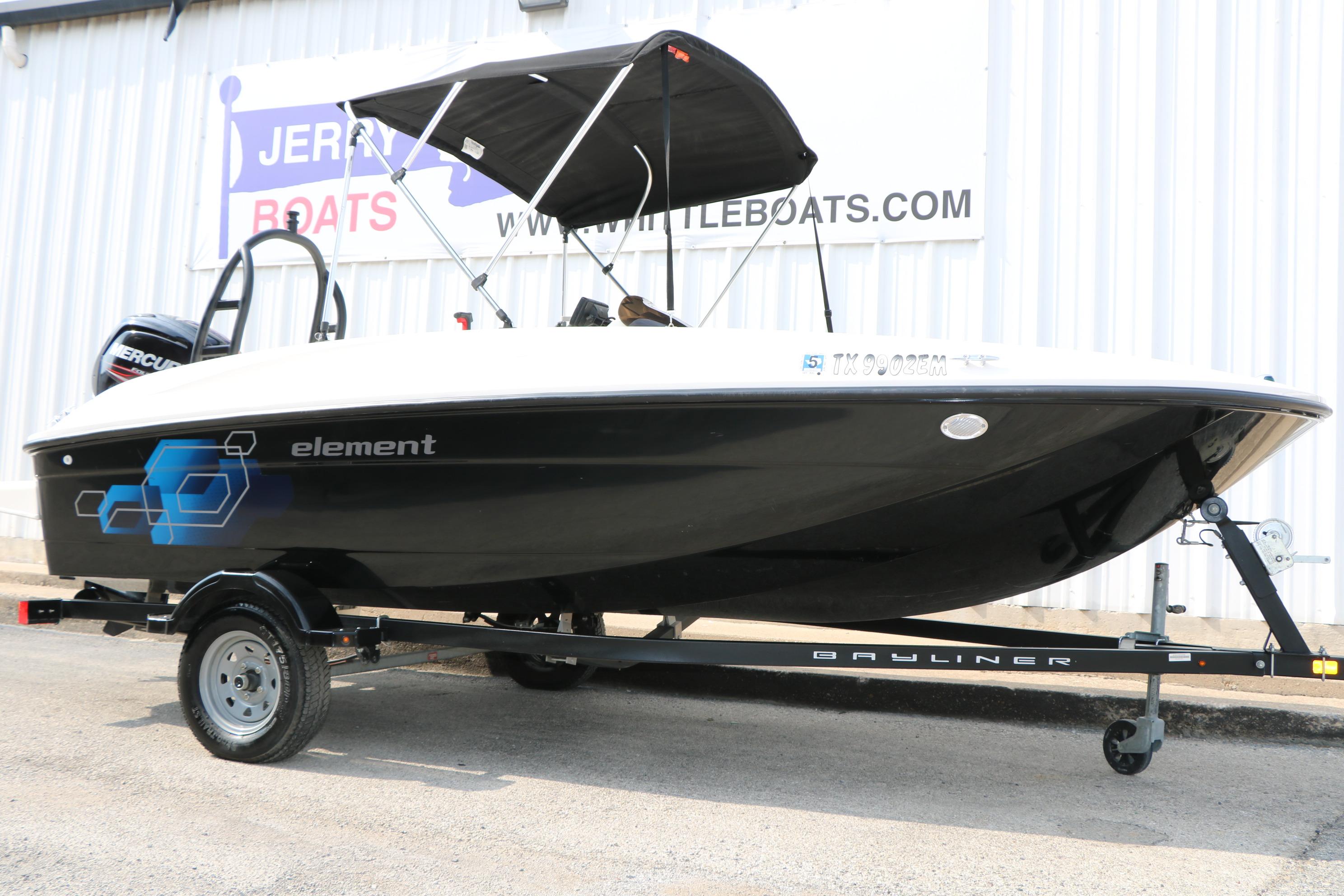Bayliner Element E16 2019 Bayliner Element E16 boat on trailer with canopy, displayed outdoors.