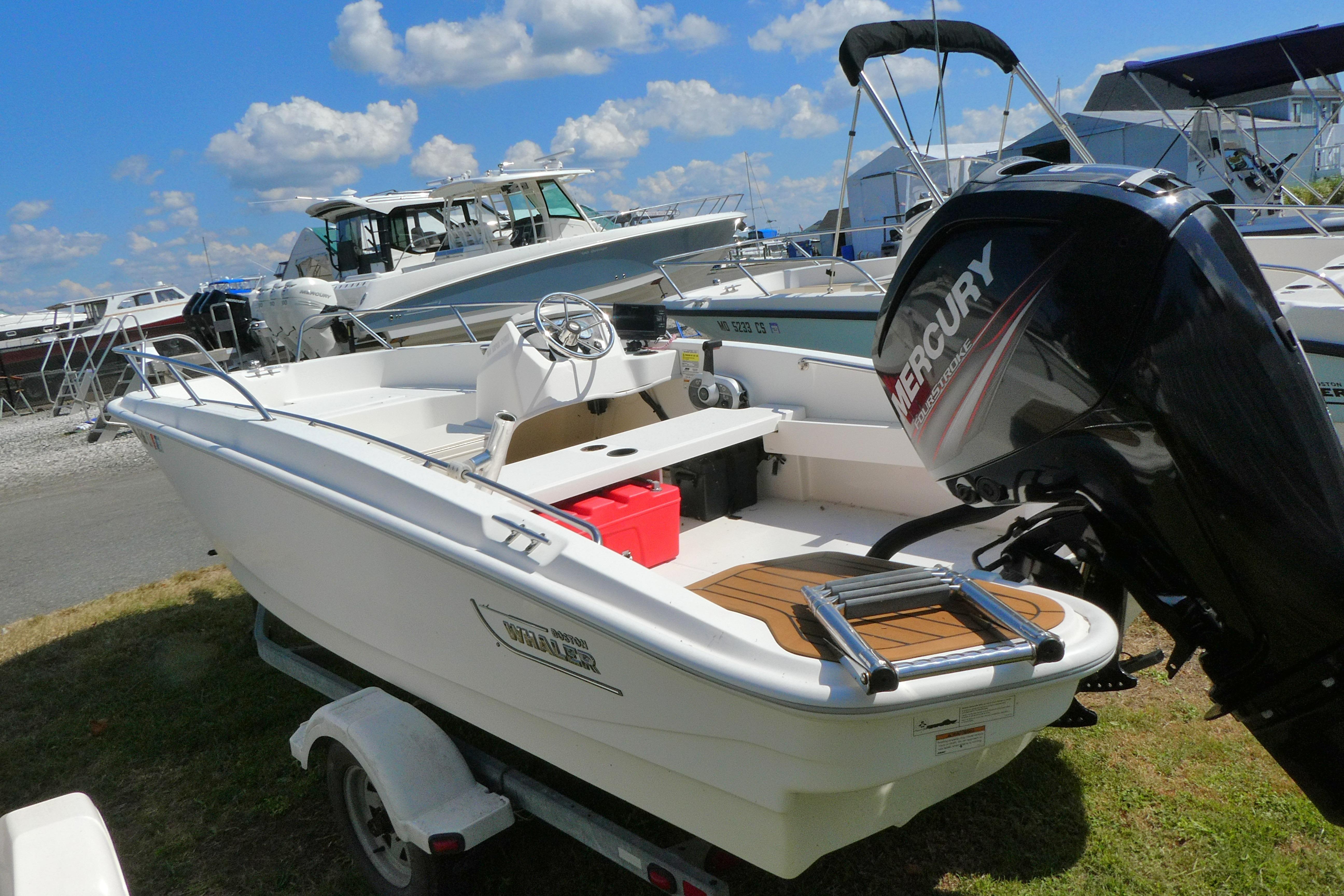Boston Whaler 160 Super Sport 2019 Boston Whaler 160 Super Sport boat with Mercury engine on trailer.