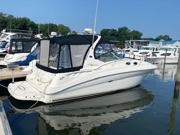 Sea Ray 320 Sundancer 2004 Sea Ray 320 Sundancer docked at a marina.