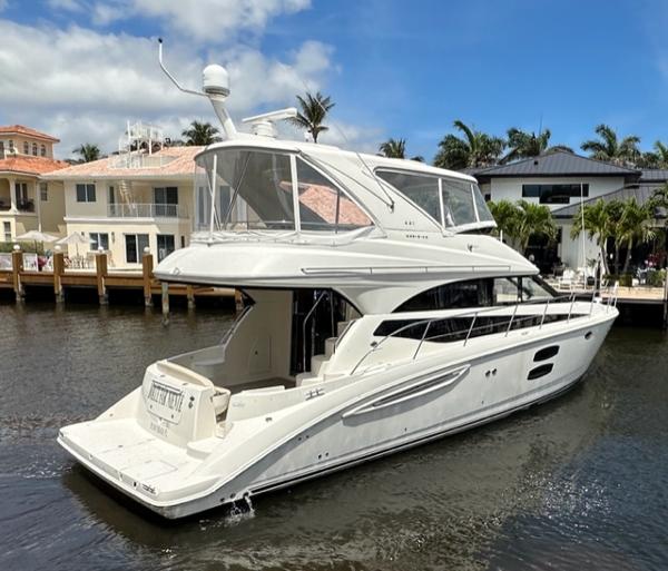 Meridian 441 Sedan 2013 Meridian 441 Sedan yacht docked in a residential canal.