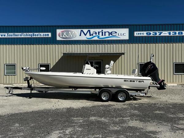 Skeeter SX230 2024 Skeeter SX230 boat on trailer outside L&M Marine LLC building.