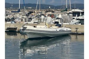 Capelli Tempest 775 2016 Capelli Tempest 775 boat docked in a marina, surrounded by other vessels.