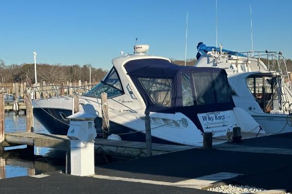 Sea Ray 330 Sundancer 2008 Sea Ray 330 Sundancer docked at marina under clear blue sky.