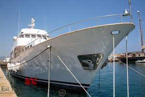 Benetti 33 1972 Benetti 33 yacht docked in a marina under clear blue skies.