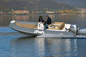 BWA Sport 19 GTO 2025 BWA Sport 19 GTO boat cruising on a serene lake with scenic background.
