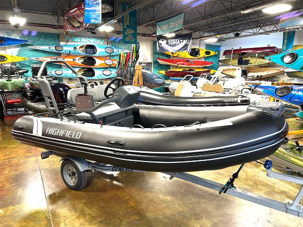 Highfield Classic 400 2025 Highfield Classic 400 inflatable boat in showroom with kayaks and equipment.