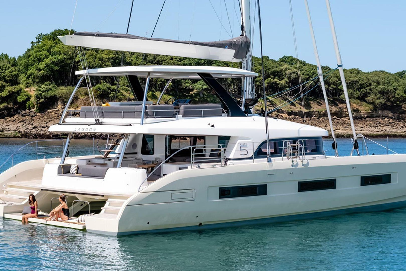 Lagoon lagoon 65 2025 Lagoon 65 yacht on serene water, featuring spacious deck and modern design.