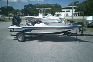 Nitro Z-7SC 2015 Nitro Z-7SC boat on trailer, parked outdoors, featuring Mercury engine.