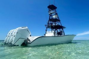 Conch 41 Center Console 2023 Conch 41 Center Console boat with multiple Mercury engines in clear water.