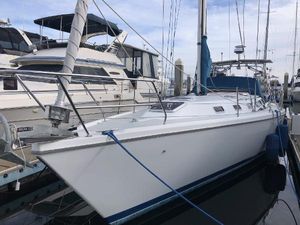 Catalina 42 MkII 1996 Catalina 42 MkII sailboat docked at marina, side view.