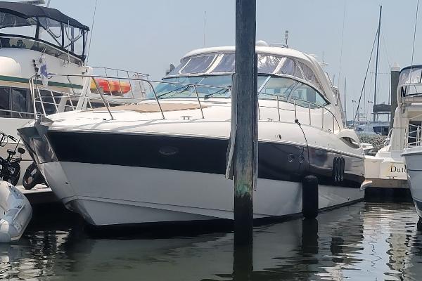 Cruisers Yachts 520 Express 2005 Cruisers Yachts 520 Express docked at a marina.