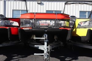 Sea-Doo Switch 16 - 130 2024 Sea-Doo Switch 16 - 130, vibrant red and yellow, parked on trailer.