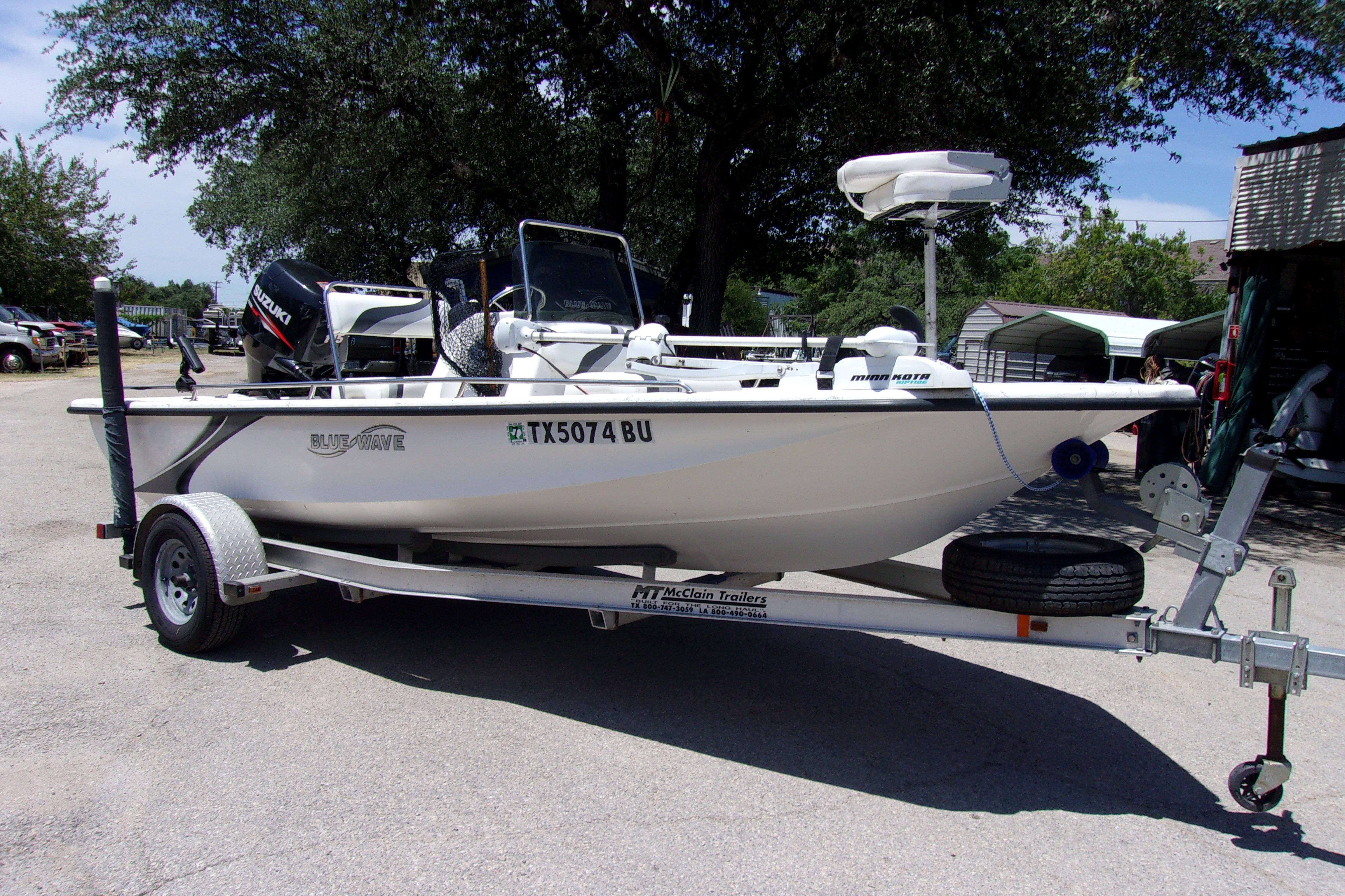 Blue Wave 180 Super Tunnel 2011 Blue Wave 180 Super Tunnel boat on trailer, parked outdoors.