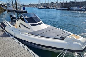 Lomac Granturismo 2026 Lomac Granturismo boat docked in a marina with clear blue water.