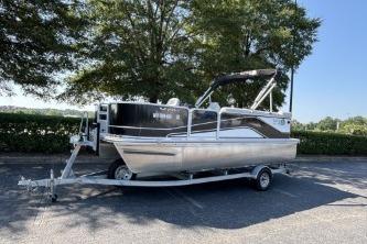 SunCatcher V20 Fish & Cruise 2020 SunCatcher V20 Fish & Cruise pontoon boat on trailer, parked outdoors.
