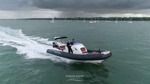 Grand G850 2020 Grand G850 boat cruising on a cloudy day with multiple sailboats in the background.