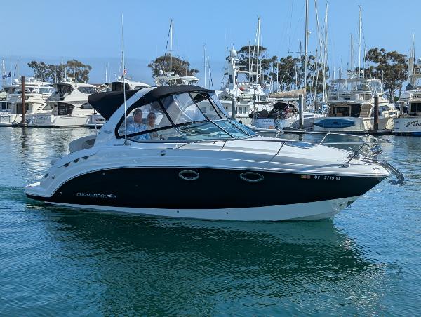 Chaparral Signature 270 2011 Chaparral Signature 270 boat in a marina with other yachts.