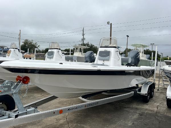 NauticStar 214 Bay 2024 NauticStar 214 Bay boat on a trailer in a marina.