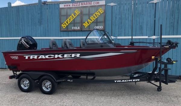 Tracker Targa v18 combo 2025 Tracker Targa V18 Combo boat in red, parked on a trailer.
