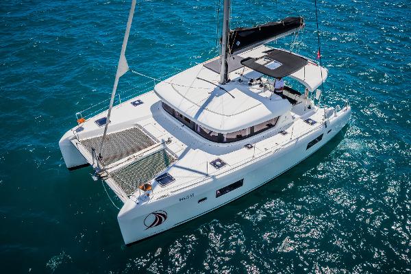 Lagoon 42 2018 Lagoon 42 catamaran sailing on clear blue ocean waters.