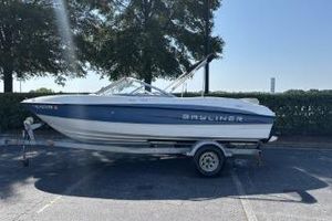 Bayliner 185 Bowrider 2011 Bayliner 185 Bowrider boat on trailer, parked outdoors.