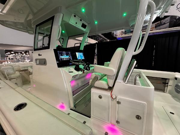 Sea Pro 322 DLX 2025 Sea Pro 322 DLX boat interior with illuminated control panel and seating.