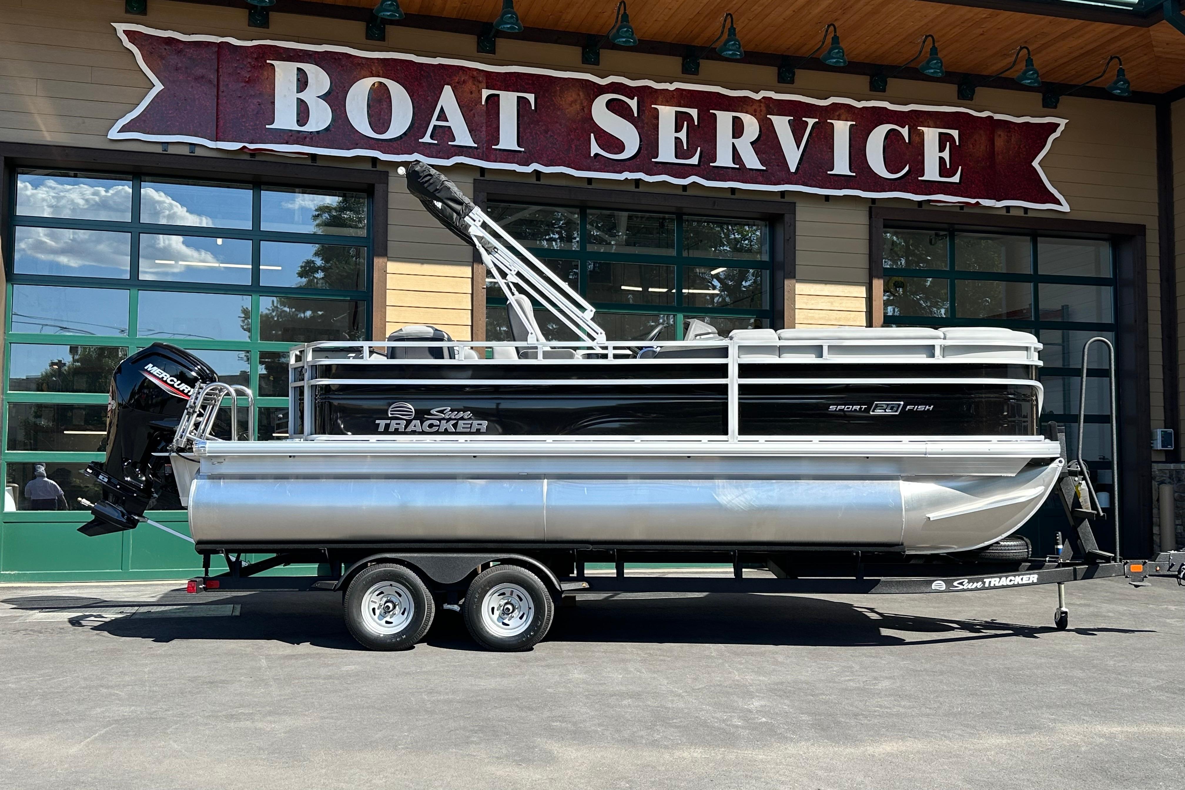 Sun Tracker SportFish 20 DLX 2026 Sun Tracker SportFish 20 DLX pontoon boat at boat service center.